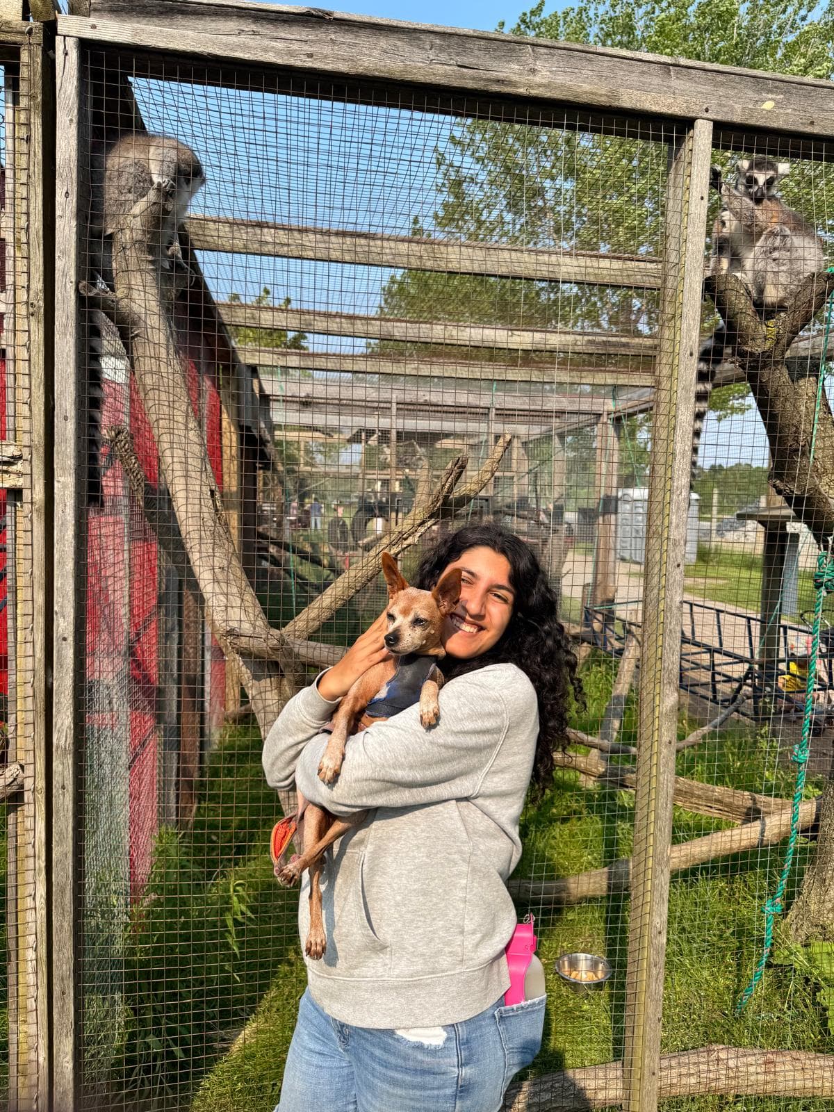 Amelia with a small dog at a sanctuary